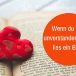 Aufgeschlagenes Buch mit einem roten Stoffherz als Lesezeichen. Text: Wenn du dich unverstanden fühlst, lies ein Buch!